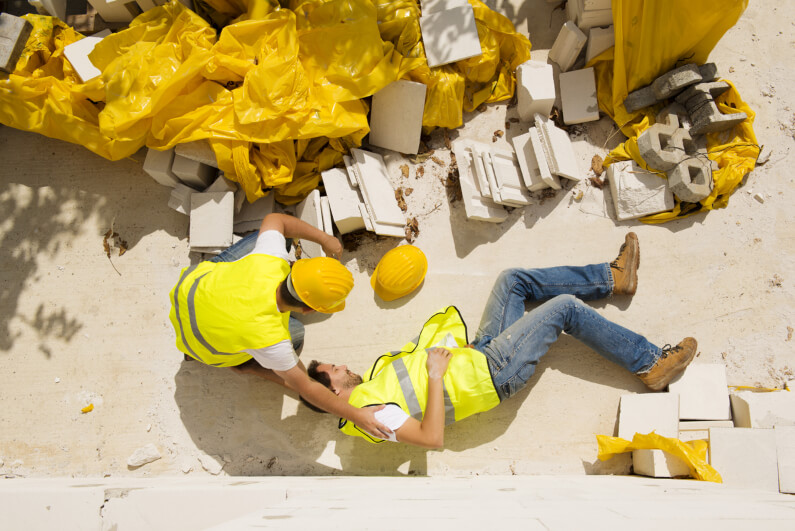 Man lying on the ground after construction accident