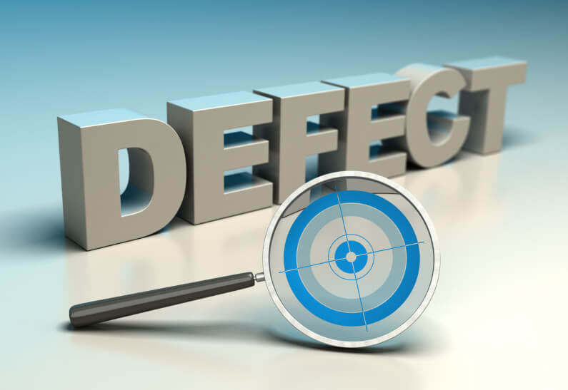The word defect behind a magnifying glass with a target 